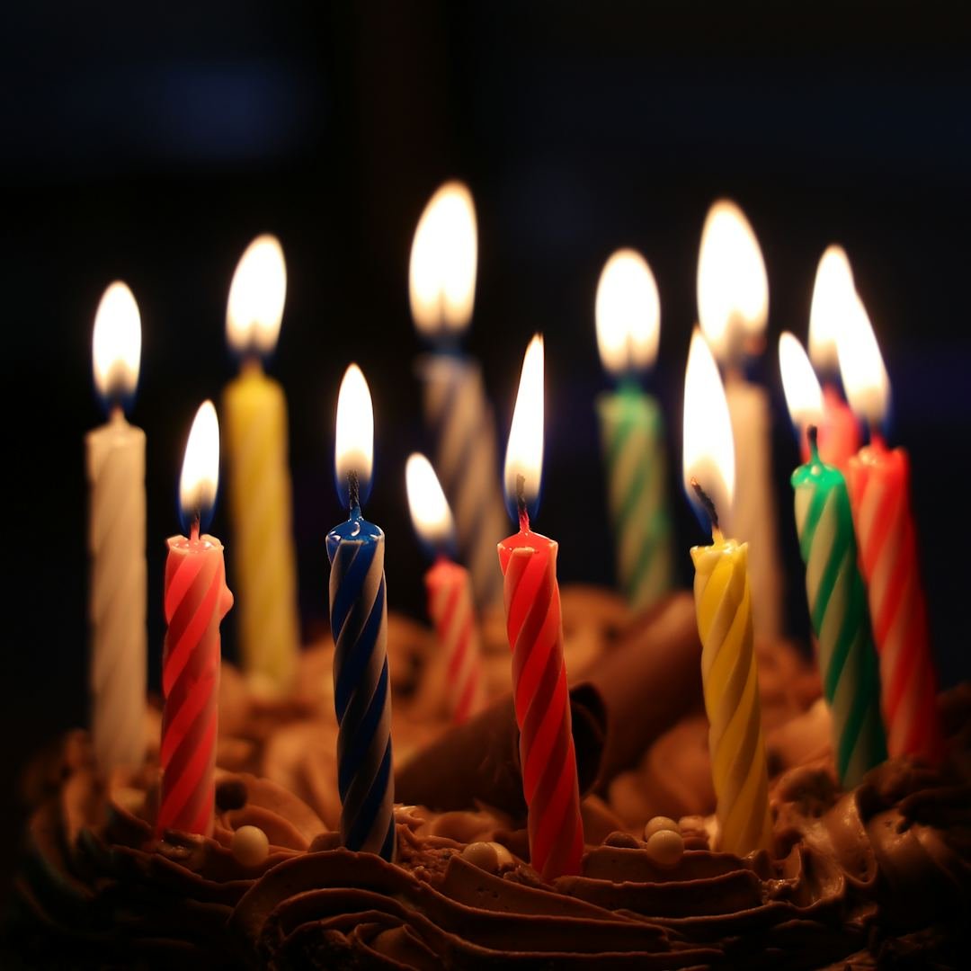 Lighted candles on a cake, birthday prayers and blessings