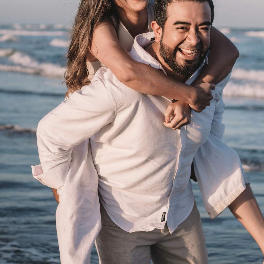 Man and woman in white embracing for romantic and poetic freaky spanish lines