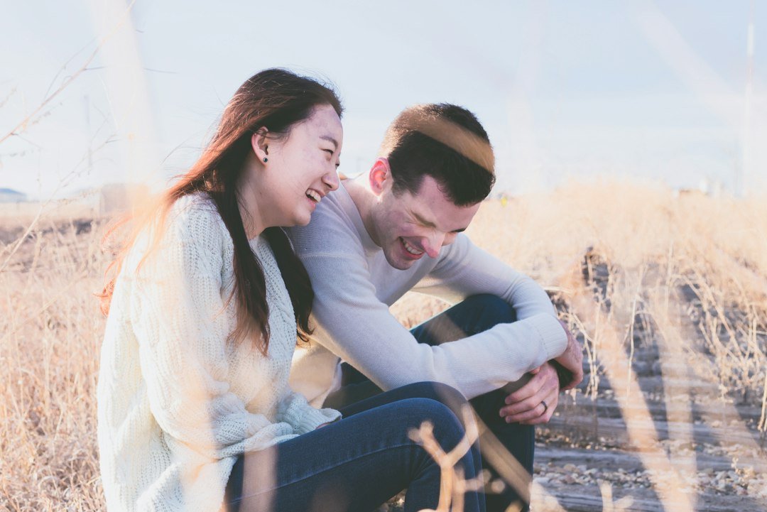 Man and woman laughing, perfect for funny angry birds pick up lines