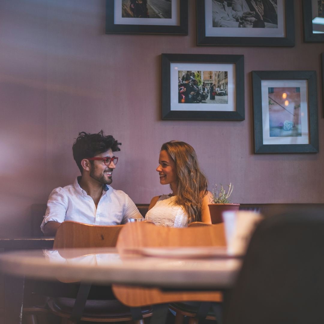 Man looking at a woman on a couch, cute absolutely pick up lines that feel sweet