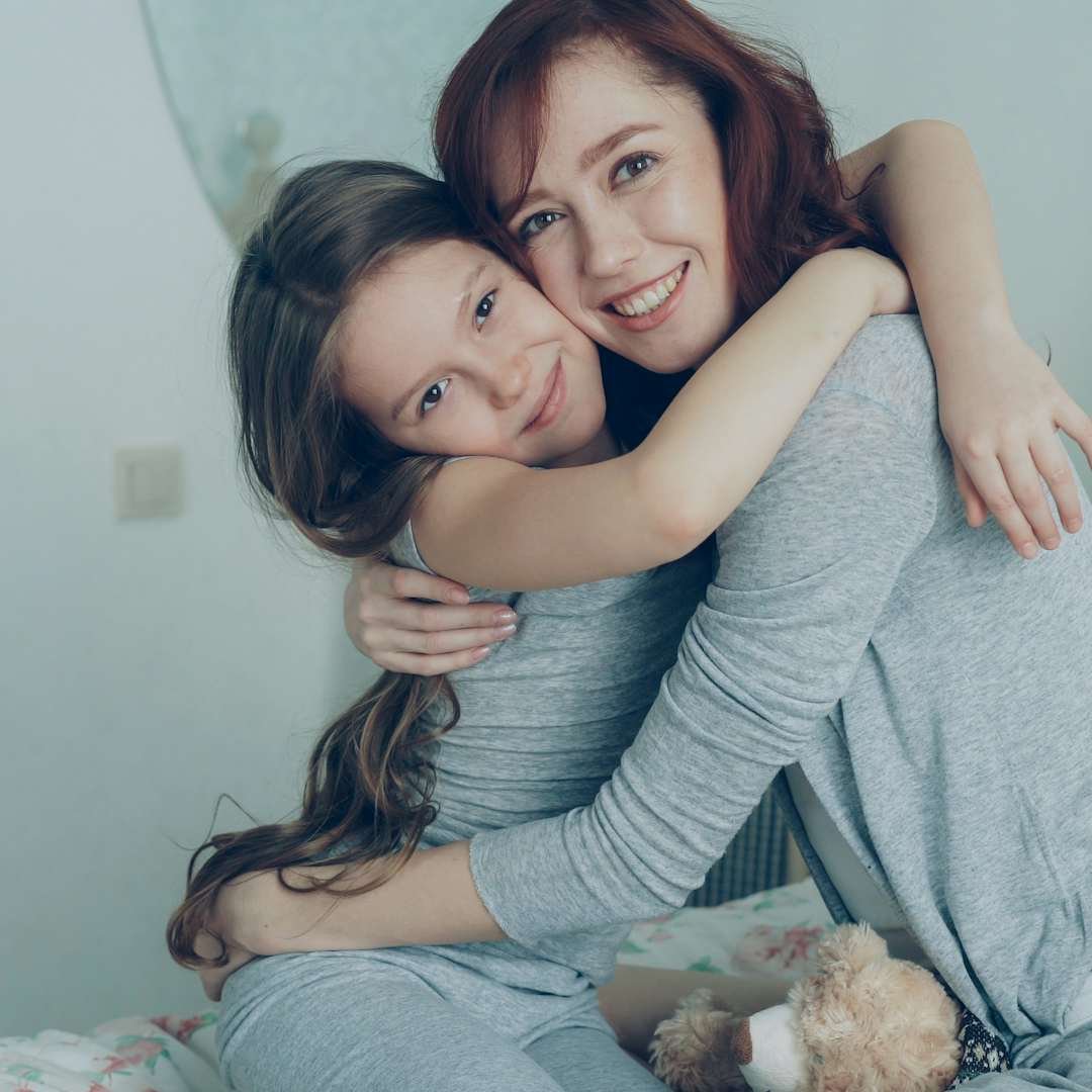 Mother and daughter sharing a warm hug, happy birthday blessings for mom