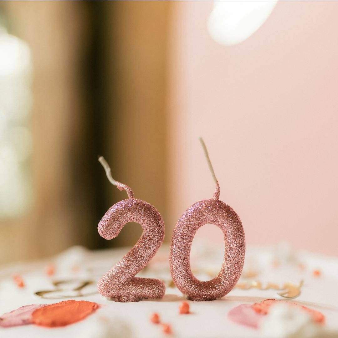 Pink glitter candles spelling a number, milestone happy birthday blessings